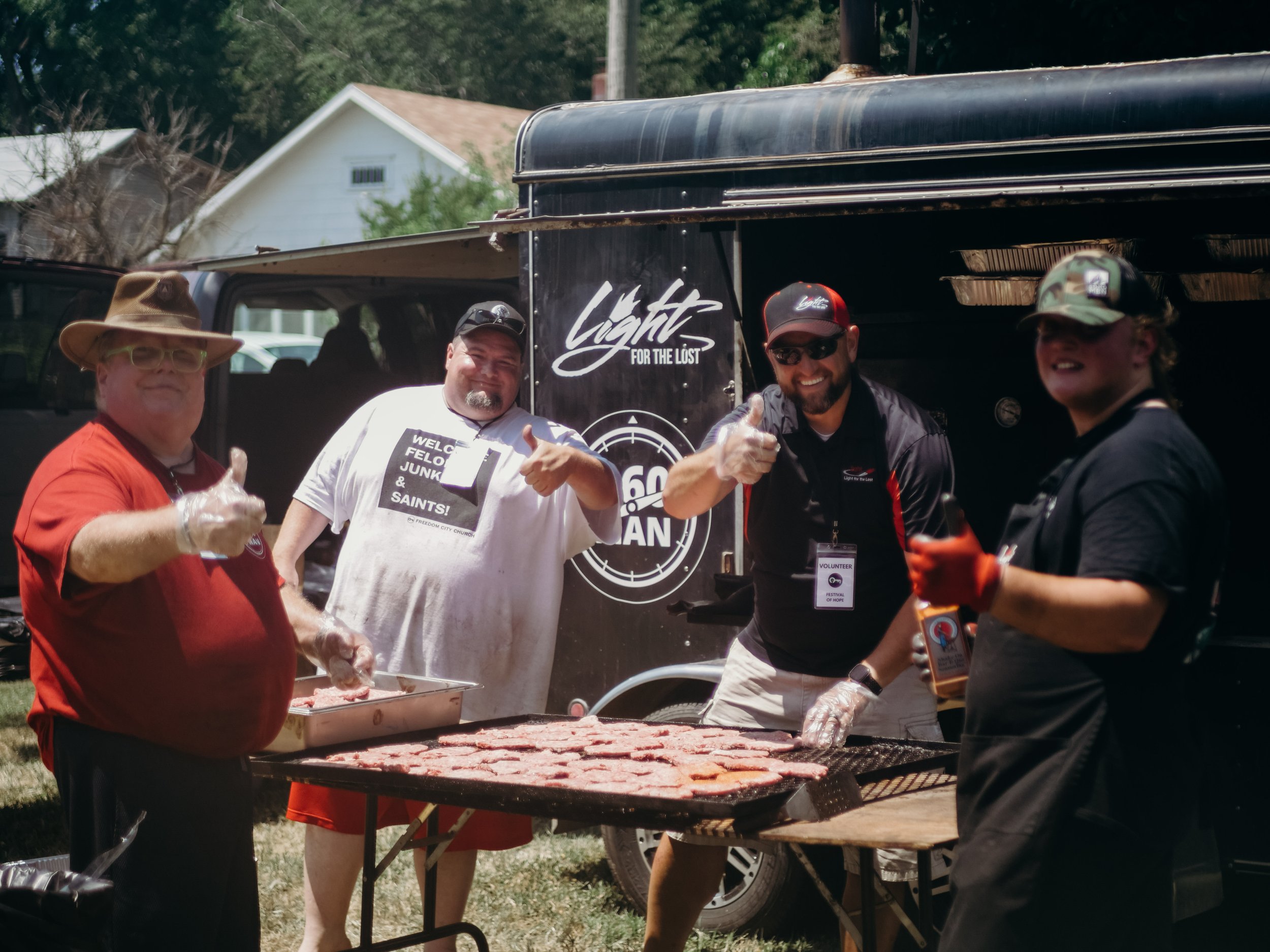Residents making BBQ for a community event.