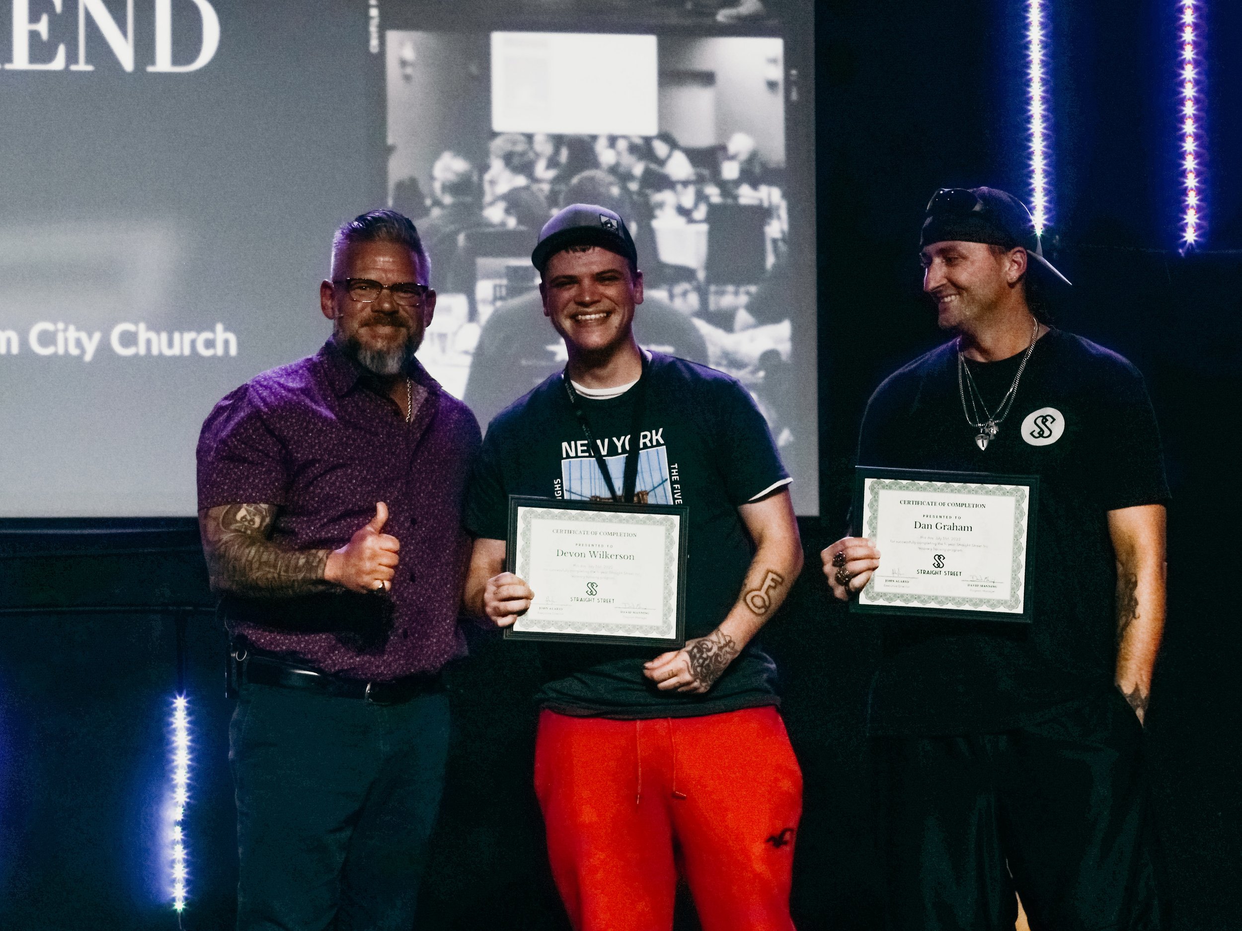 Graduating resident with Executive Director, John Alarid.